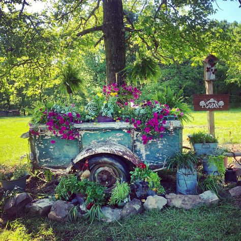 I used my husband’s grandfather’s 60 plus year old trailer made out of a truck bed as a huge planter! Old Truck Bed Ideas, Truck Bed Decorating Ideas, Truck Bed Planter, Old Truck Bed Ideas Yards, Dump Truck Flower Bed, Tractor Garden Decor, Old Pickup Trucks With Flowers, Trailer Garden Ideas, Old Truck Flower Bed Garden Ideas