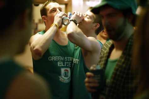 Joshua Beckman, The Daily Illini    At an 6AM ‘Keg ‘N Eggs’ party in an apartment on Third St. in Champaign, Unofficial revelers race each other to drink a can of beer on Friday, March 2, 2012. Irish Trash Can Drink, The Irishman Movie, Jack Daniels Pedro Pascal, The Greatest Beer Run Ever Movie, Can Of Beer, The High Kings Irish Band, Kiss, Beer, Apartment