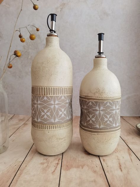 "Handmade Ceramic oil bottle, this unique olive oil  glazed with a food safe glaze perfect for the rustic kitchen.  This olive oil is practical when cooking and when eating .   Dimensions:  LARGE - Holds approx. 40 oz 9.8\"(25cm) tall and 3.5\"(9cm) wide MEDIUME - Holds approx. 30 oz 7.8\"(20cm) tall and 3.5\"(9cm) wide   ♥ All pieces are dishwasher and microwave safe. ♥ All items are packed with recycled materials and well safely packed. ♥ Stoneware fired at 1210c /2220F - food-safe glazes. ♥ All items are handmade and please allow for small differences in size, shape, and color. Back to my shop - https://etsy.me/33uRLBK if you have any questions, don't hesitate to ask! I am happy to assist. Thank you, Yael" Ceramic Oil Bottle, Ceramic Containers, Olive Oil Bottle, Olive Oil Dispenser, Olive Oil Bottles, Pottery Shop, Kitchen Jars Storage, Oil Bottle, Dream House Decor