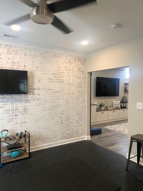 Faux brick wall with german smear Faux Brick Garage Wall, Home Gym Brick Wall, Faux White Brick Wall Laundry Room, Faux Brick Wall Home Gym, Faux Brick Wall Panels Garage, Faux Brick Wall Panels Basement, Faux Brick Wall Basement Bar, German Smear, Fake Brick