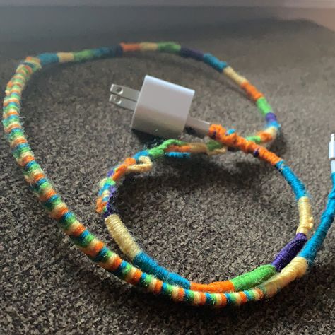 Using multiple colors of yarn i decorated my charger cord. No more sticky fingers 😂✊🏽 Charger Cord Wrap, Diy Chargers, Sticky Fingers, Cord Wrap, Charger Cord, No More, Rope Bracelet, Art Ideas, Yarn