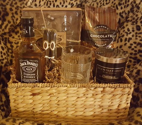 Available for sale! FATHERS DAY GIFT BASKET~Flask set, chocolate popcorn, Platinum (very manly) scented soy candle, RL (Ralph Lauren) crystal double old fashioned glass, 1 pt Jack Daniels whiskey, 2 Onyx Reserve Toro cigars, and reusable basket. ~$125.00.~Free delivery in certain parts of the Tri-State (Pa., NJ, De.) area. PayPal and shipping available. Whiskey Gift Basket For Men, Whiskey Raffle Basket Ideas, Whiskey Gift Basket Ideas, Alcohol Baskets, Valentines Gala, Whiskey Gift Basket, Mens Gift Basket Ideas, Liquor Baskets, Mens Gift Basket