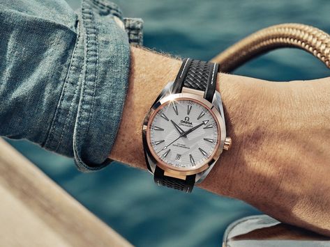 Close-up shot of Eddie Redmayne's wrist and his Seamaster Aqua Terra watch, with stainless steel case, gold bezel and white teak dial. AQUA TERRA 150M  OMEGA CO-AXIAL MASTER CHRONOMETER 41 MM  220.22.41.21.02.001  Steel - sedna™ gold on rubber strap Omega Co Axial, Omega Aqua Terra, Awesome Watches, Seamaster Aqua Terra, Newt Scamander, Aqua Terra, Latest Watches, Eddie Redmayne, Wrist Candy