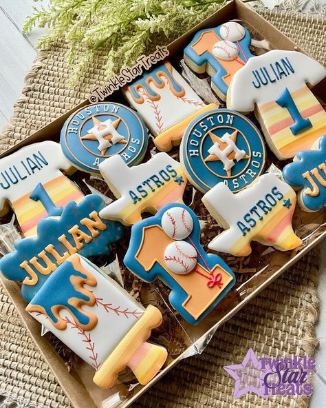 Let’s go Astros!! How fun are these Astros baseball themed 1st birthday cookies?! ⚾️ . . . #astroscookies #baseballcookies #mlbcookies #astros #astrosbaseball #twinklestartreats #cookiesforoccasion #cookiedecorating #decoratedcookies #royalicing #royalicingcookies #edibleart #cookieart #cookiedecorator #cookier #decoratedsugarcookies #instacookies #sugarcookies #sugarcookiesofinstagram #cookies #houstontx #houstoncookies #cypresstx #cypresscookies #customcookies #cookieartist #sugarcookiemar... Astros Party Food, Houston We Have A One Year Old Cookies, Astros Cookies Decorated, Houston Astros Birthday Party, Astros Ornaments, Baseball Cookies, Astros Baseball, Twinkle Star, Houston Tx