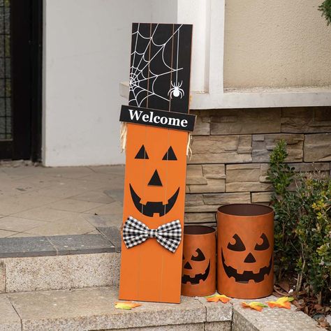 This cute reversible porch sign features the message "Happy Fall" with a scarecrow boy and "Welcome" with Jack-O-lantern wearing a black hat on each side. You just need to pay one and get two decorations for Fall and Halloween. Reversible Porch Sign, Pumpkin Porch Decor, Wooden Scarecrow, Porch Decor Halloween, Pumpkin Porch, Dollar Tree Halloween Decor, Porch Fall Decor, Scarecrow Pumpkin, Porch Pumpkins