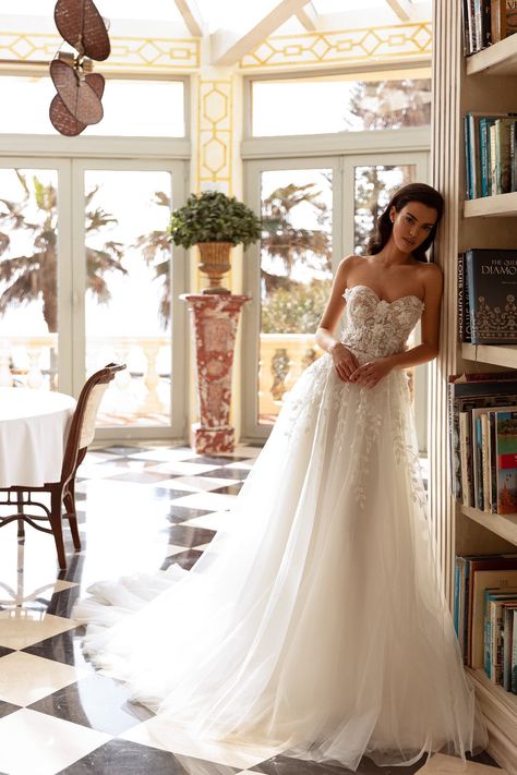 This strapless elegant ball gown wedding dress exudes timeless sophistication. Floral accents delicately adorn the waist and gracefully cover the bosom, adding a touch of romance and enchantment to this stunning ensemble, perfect if you are seeking classic elegance with a touch of floral charm. Simple Off Shoulder Wedding Dress, Elegant Timeless Wedding Dress, Sweet Heart Wedding Dress, Kleinfeld Wedding Dresses, Lace Strapless Wedding Dress, Strapless Ball Gown Wedding Dress, Elegant Ball Gown Wedding Dress, Timeless Wedding Gown, Marie Antoinette Dresses