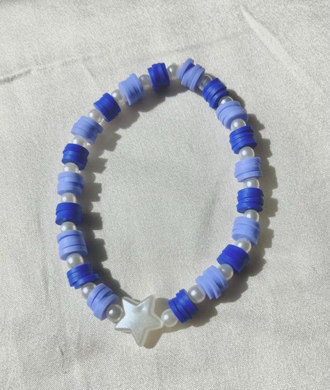 Cute blue and white beaded bracelet. These are high quality handmade bracelets. They are made with an very stretchy and strong elastic string so will fit lots of sizes. They are around 6.75 inches. Please note that each braclet will have a very similar beading pattern but not exactly identical. Braclete Pattern Beads, Blue Clay Bead Bracelets, Clay Bead Bracelet Ideas, Doctor Who Jewelry, Bracelet Clay, Clay Beaded Bracelet, Make Clay Beads, White Beaded Bracelet, Bracelet Inspo