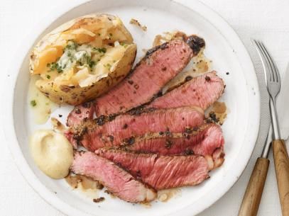 Herb-and-Mustard Sirloin With Baked Potatoes Recipe | Food Network Kitchen | Food Network Steak With Blue Cheese, Meat And Potatoes, 30 Minute Dinners, Baked Potato Recipes, Food Network Magazine, Skirt Steak, Baked Potatoes, Potatoes Recipe, Beef Dishes