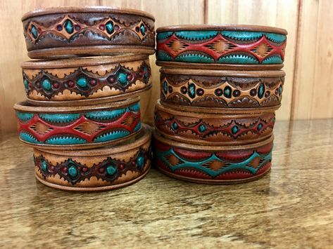 Hand cut, tooled & painted leather bracelets Leather Tooled Bracelet Cuffs, Leather Tooled Bracelet, Western Leather Bracelet, Leather Cuff Bracelet Diy, Diy Boots, Leather Braclet, Leather Cuff Bracelets, Handmade Leather Work, Leather Working Patterns