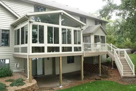 Patio rooms installed above walk out basements are popular for the added space they bring to split level homes. Outdoor stairs leading up to the deck and sunroom are a convenient way for the kids to enter the house after playing outdoors. 4 Season Room, Four Seasons Room, Sunroom Addition, Three Season Room, Sunroom Ideas, Sunroom Designs, Deck Designs Backyard, Split Level House, Outdoor Stairs