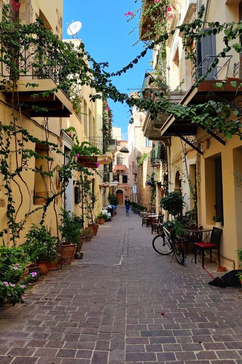 If you're visiting Chania in Crete, and you should be, you must take some time to wander the small streets of the Old Town. From small boutique shops to creeping vines and friendly cats, there is something around every corner. For more info about visiting Chania including how to get there, what to do and where to stay, click the pin to read our Chania Travel Guide. #chania #europe #greece #crete #travelguide #travelblog #citybreak #oldtown #saveforlater Crete Greece Chania, Crete Travel, Chania Greece, Crete Chania, Greek Town, Creeping Vines, Greece Crete, Europe Holidays, Small Town Life