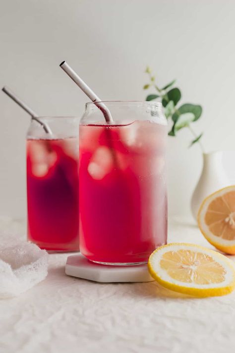 Glasses of Iced passion tea lemonade with metal straws on white coaster. Iced Passion Tea, Starbucks Passion Tea, Lemonade Simple Syrup, Tazo Passion Tea, Lemonade Tea Recipe, Passion Tea Lemonade, Iced Tea Lemonade, Passion Tea, Tea Lemonade