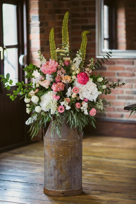 Milk Churn Flower Arrangements, Milk Churn Wedding Flowers, Rustic Arrangements, Church Wedding Flowers, Milk Churn, Large Flower Arrangements, Spring Floral Arrangements, Flower Arrangements Simple, Wedding Table Flowers