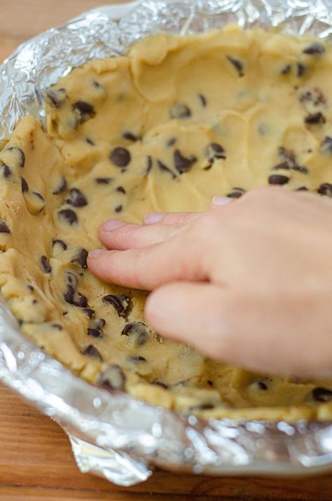 Chocolate Chip Cookie Dough Ice Cream Pie Recipe: Creamy chocolate chip cookie dough ice cream is the filling for this frozen pie and sits atop a buttery chocolate chip cookie crust. Get the chocolate chip cookie dough pie crush recipe as well as the chocolate chip cookie dough ice cream recipe to put together this delicious treat, perfect for alternative birthday cake ideas or summer dessert ideas for a crowd. Ice Cream Cookie Bowls, Chocolate Chip Cookie Crust Dessert, Cookie Dough Pie Recipe, Cookie Dough Pie Crust, Alternative Birthday Cake Ideas, Alternative Birthday Cake, Cookie Dough Ice Cream Recipe, Chocolate Chip Cookie Crust, Pie Night