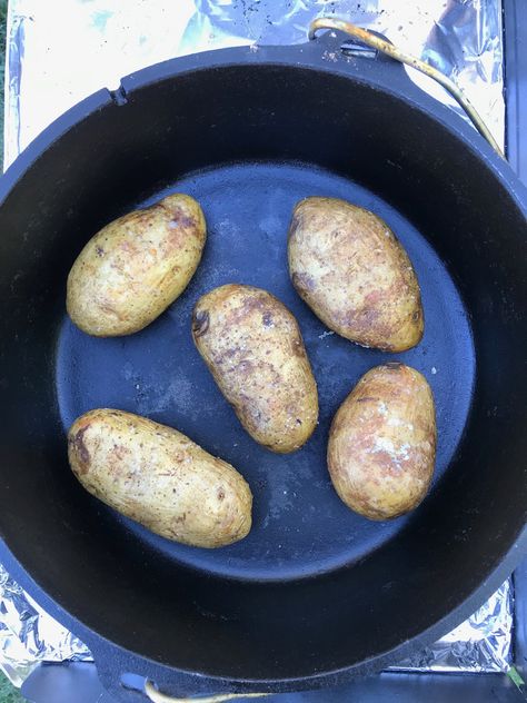 Dutch Oven Baked Potatoes - Dutch Oven Daddy Duch Oven Recipes, Dutch Oven Potatoes, Oven Baked Potatoes, Dutch Oven Recipes Cast Iron, Camp Cooking Recipes, Skillet Dinner Recipes, Dutch Oven Camping, Salted Caramel Fudge, Dutch Oven Cooking