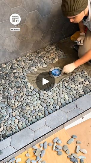 Laying pebbles for a shower 🚿 | These pebbles transform the shower and make the flooring slip-proof! 🚿🤩 | By Lessons Learned In LifeFacebook Pebble Shower Base, Pebble Shower Floors, Outdoor Shower With Pebble Floor, Master Shower Pebble Floor, Stone Bottom Shower Pebble Floor, Resin Shower Floor, Diy Tile Bathtub, Sunken Shower Floor, Bathroom With Pebbles