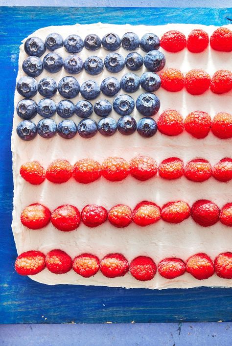 This Fourth of July American Flag Cake is made with an easy vanilla cake and simple buttercream frosting. It is always an impressive and patriotic dessert addition to your summer table or party. #fourthofjuly #patrioticdesserts #dessertrecipes #summerdesserts #july4 Simple Buttercream Frosting, Fourth Of July Cake, Fourth Of July Dessert, American Flag Cake, Holiday Dessert Table, Easy Vanilla Cake, Easy Buttercream Frosting, Fourth Of July Cakes, Holiday Desserts Table