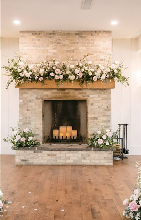 Wedding Ceremony Mantle Decor, Wedding Flowers Mantel, Floral Fireplace Wedding, Wedding Stone Fireplace Decorations, Wedding Flowers On Fireplace, Mantel Flowers Wedding, Fireplace Mantle Florals Wedding, Mantle Floral Arrangements Wedding, Wedding Decor Fireplace