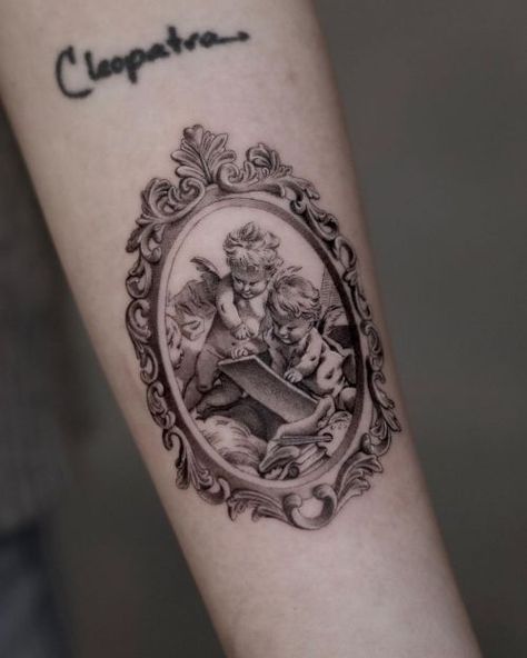 angel posts - INKPEDIA Vintage Frame Tattoo, Victorian Tattoo, Antique Tattoo, Frame Tattoo, Convention Tattoo, Framed Tattoo, Mini Tattoo, Leg Tattoos Women, Memorial Tattoos