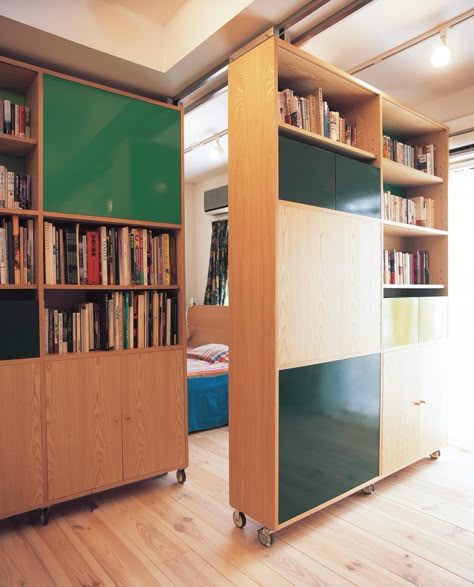 rolling, rearrangeable bookshelves Modern Room Partitions, Apartment Bookshelves, Sliding Furniture, Moving Wall, Moveable Wall, Moving Walls, Movable Walls, Bookcase Door, Bookcase Wall