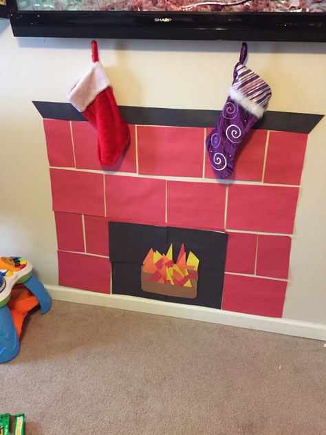 Construction paper fireplace! Paper Fireplace, Office Christmas Decorations Cubicles, Christmas Cubicle Decorations, Diy Christmas Fireplace, Cubicle Decor Office, December Crafts, Construction Paper Crafts, Christmas Shadow Boxes, Paper Christmas Decorations