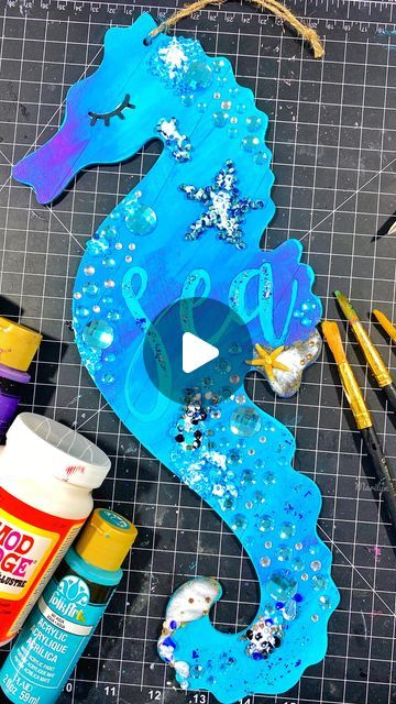 Jazzy | DIY + Crafter | Latine Content Creator on Instagram: "S E A H O R S E. What color should I try next?? Loving the Under the Sea collection from the @dollartree. I found everything I needed to create this sign at the DollarTree: gems, glitter, embellishment, and they also have paints available. #painting #dollartree #underthesea #mermaid #disney #seahorse #beachlife #beachy #dollartreedecor #dollartreediy #dollartreefinds #diycrafting #dollartreecommunity #dollartreeobsessed #friday #fridaymood #friyay #blue #glitter #sparkle" Diy Seahorse Crafts, Seahorse Crafts, Dollar Tree Finds, Dollar Tree Decor, Dollar Tree Diy, Content Creator, I Tried, Dollar Tree, Under The Sea