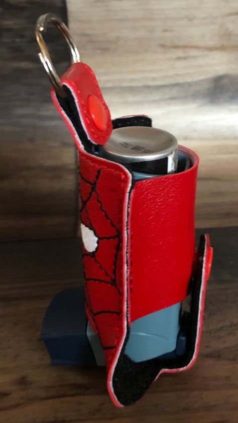 Red Spider Man Inhaler Holder With Snap Closure and A Key Ring Keep your inhaler out of the bottom of your bag or purse with a inhaler holder keyring. No more asthma attacks and not being able to find where you put your inhaler. Made our of marine vinyl, felt, plastic snaps, and a metal key ring. Inhaler Holder, Asthma Inhaler, Red Spider, Asthma Attacks, You Bag, Key Ring, Key Rings, No More, Snap Closure