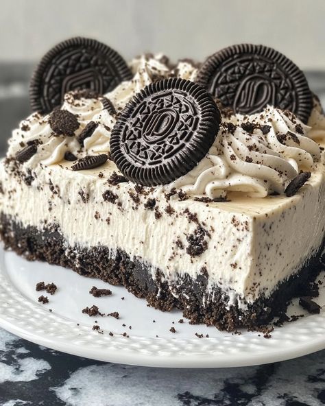 No-Bake Oreo Cheesecake 🖤🍪🍰 This No-Bake Oreo Cheesecake is a decadent, creamy dessert that combines the rich flavor of Oreos with a smooth cheesecake filling. It's perfect for when you want a delicious treat without turning on the oven! Ingredients: For the Crust: 24 Oreo cookies, crushed 1/4 cup unsalted butter, melted For the Cheesecake Filling: 2 (8 oz) packages cream cheese, softened 1 cup granulated sugar 1 tsp vanilla extract 1 cup heavy cream 1 cup crushed Oreo cookies (about 10 ... Oreo Cheesecake Aesthetic, Oreo Snacks, Oreo Cheesecake Cups, Cheesecake Aesthetic, Smooth Cheesecake, Crushed Oreo, No Bake Oreo Cheesecake, Cheesecake Cups, Dessert Photography