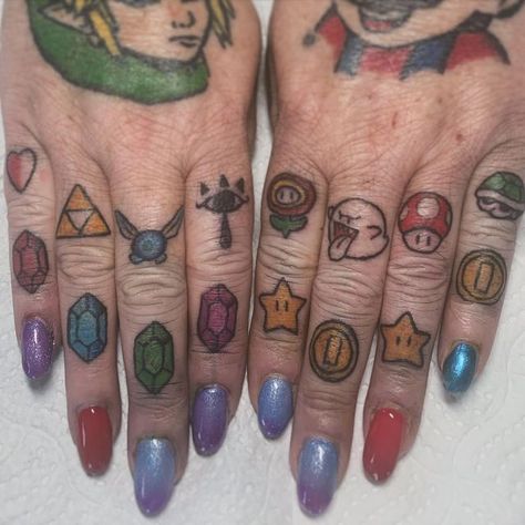 TWEGGY TATTOO / Liverpool 🏳️‍🌈 on Instagram: "COLOUR TAT! First time tattooing fingers!! Thank you for the trust @jaynie_frost 🩷💙💚💜  #mario #link #zelda #mariobros #fingertattoos" Super Mario Tattoos, Minimalist Mario Tattoo, Tiny Mario Tattoo, Toon Link Tattoo, Mario Star Tattoo, Mario Sleeve Tattoo, Minimal Zelda Tattoo, Fierce Deity Link Tattoo, Mario Tattoos