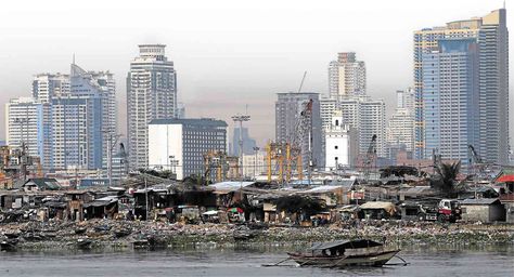 A SLUM in Baseco, Tondo in Manila, with high rises in the background         EDWIN BACASMAS Philippines Manila, Human Settlement, Quezon City, Rural Area, Local Government, Not Afraid, Bright Lights, Relocation, San Francisco Skyline