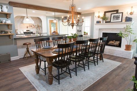 Clint built this table for the Beachums to gather around for holidays together. It turned out perfectly for this space, and the family loved it. Farmhouse Dining Room With Fireplace, Dining Room With Fireplace Layout, Joanna Gaines Dining Room, Beam Ideas, Fixer Upper Dining Room, Fireplace Dining Room, Dining Room With Fireplace, Joanna Gaines Decor, Ranch Home Remodel