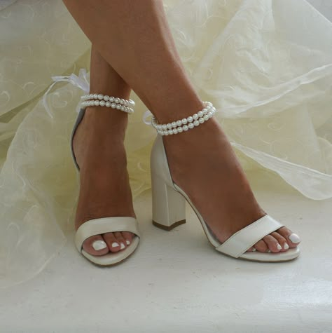 SHIPPING via DHL EXPRESS WORLDWIDE: ( Your phone number is required by DHL ) A stunning pair of ivory heeled leather sandals, our ESTER sandals are handcrafted from premium ivory leather, featuring pearl ankle straps, a lightly padded foot bed for extra comfort, and are finished with a chic block heel. ESTER  is the most elegant and comfortable choice for your special day or any fancy evening out. They compliment the foot offering an elegant and delicate look. Our sandals are handmade with care Wedding Day Heels Brides, Bridal Shows, Bridal Shoes Pearl, Wedding Block Heels Bride, Wedding Bride Shoes, Comfortable Wedding Heels For Bride, Bride Heels Wedding, Wedding Shoes Pearl, Shoes For Bride