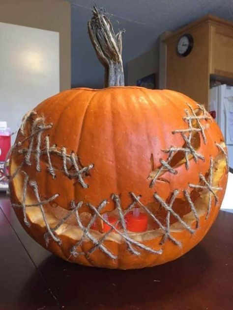 27 Unbelievably Clever Pumpkin Carving Ideas For Halloween Pumpkin With Mouth Sewn Shut, Cool Jackolantern Ideas, Stitched Pumpkin Carving, Spooky Jack O Lantern Ideas, Easy Pumping Carving, Halloween Cubical Ideas, Holloween Decore Idea Outside Diy, Jack O'lantern Ideas, Jack O Lanterns Ideas