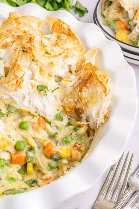 Chicken Pot Pie with Phyllo Dough is a hearty dinner recipe using shredded rotisserie chicken, frozen mixed vegetables, cream of chicken soup and sheets of phyllo dough. Pot Pie With Phyllo Dough, Philo Recipes, Chicken Pot Pie With Phyllo, Frozen Mixed Vegetables, Easy Chicken Pot Pie Recipe, Phyllo Dough Recipes, Chicken Main Dish Recipes, Recipes Using Rotisserie Chicken, Shredded Rotisserie Chicken