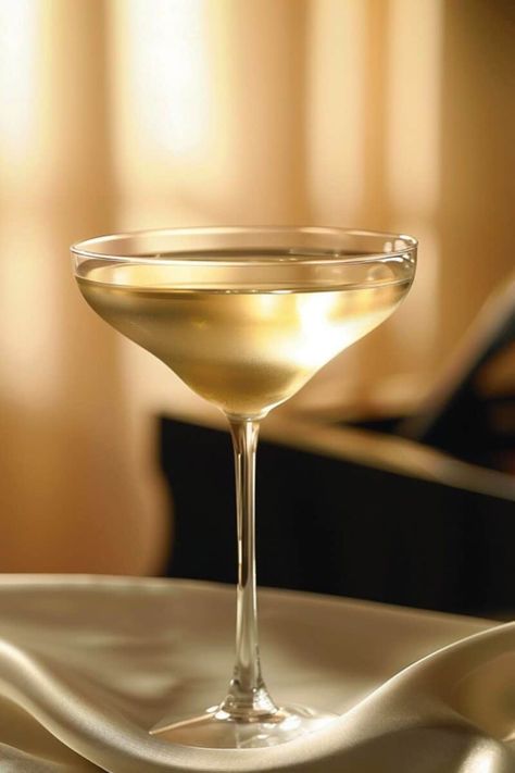 Elegant vodka martini in a chilled glass, garnished with a lemon twist, embodying luxury cocktail craftsmanship. Coconut Vodka, Lemon Twist, Vodka Martini, Easy Cocktail, St Germain, Coco Chanel, Martini, Vodka, Blending