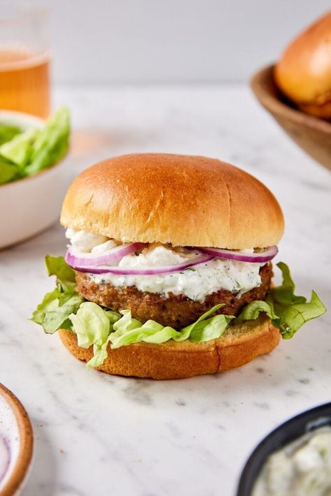 Enjoy a taste of the Mediterranean with these delicious Greek turkey burgers topped with homemade tzatziki sauce and crumbled feta cheese. Perfect for a healthy and flavorful summer meal! Greek Turkey Burgers With Tzatziki Sauce, Wyseguide Recipes, Burgers At Home, Rustic Cooking, Clean Liver, Greek Turkey, Easy Burger Recipe, Wyse Guide, Greek Turkey Burgers