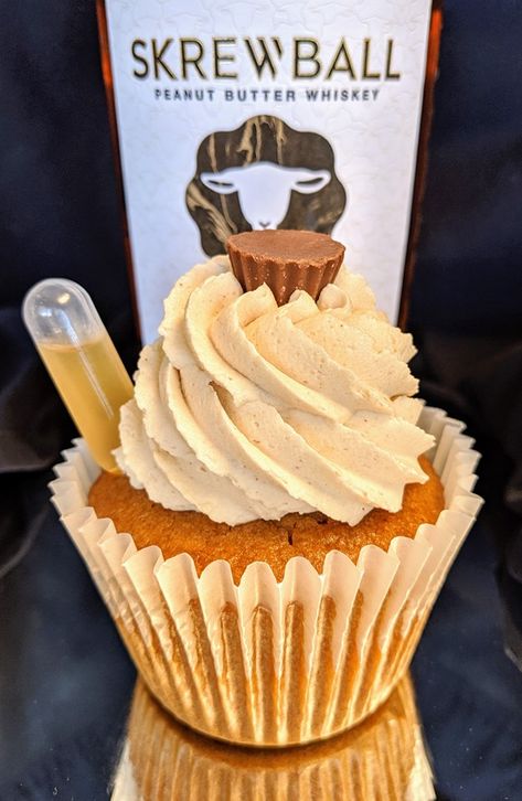 ~The Skrewball Peanut Butter Whiskey Pattycake~ It's a peanut butter cupcake bursting with a vanilla creme center, all drenched in #Skrewball Peanut Butter Whiskey! What is #Skrewball Peanut Butter Whiskey? You ask. Well, the best description would be "The best tasting PB "Hooch" this side of the Mississippi!" This cupcake is then topped with the silkiest Skrewball Peanut Butter-Butter cream! Found at Greg's Drive In Restaurant, in Lincoln, Nebraska. Live Life To The Fullest™ Pipette Food Ideas, Peanut Butter Whiskey Dessert, Screwball Cupcakes, Peanut Butter Cup Martini Screwball, Screwball Peanut Butter Whiskey Drinks, Cupcakes With Liquor Pipettes, Peanut Butter Whiskey Cupcakes, Cupcakes With Pipettes Liquor, Whiskey Butter