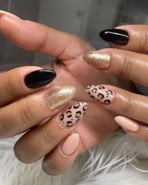 Nude, gold, and black nail colors with leopard print nail art on medium almond nails Leopard Print Nails Almond Shape, Chetta Print Nail, Fall Cheetah Print Nails, Almond Shaped Nails Designs Fall, Acrylic Nails Cheetah Print, Cheetah Accent Nails, Nude Cheetah Nails, Brown Cheetah Nails, Acrylic Nails Cheetah