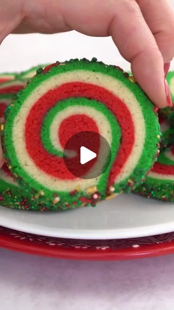 Elizabeth (SugarHero.com) • Dessert Recipes 🧁🍩🍰🍪 on Instagram: "Festive Pinwheel Sugar Cookies are beautiful AND delicious! 💚❤️ Comment “Pinwheel” and I”ll DM you a link to the recipe! 🌀 These are made with a simple sugar cookie dough, rolled into a beautiful red, white, and green spiral design, and rolled in sprinkles. ✨ WHAT YOU’LL NEED: • 12.75 oz all-purpose flour, (3 cups) • 1 tsp baking powder • ½ tsp salt • 8 oz unsalted butter, (1 cup), at room temperature • 8.75 oz granulated sugar, (1.25 cups) • 1 large egg, at room temperature • 2 tsp vanilla extract • Red and green food coloring, I used Americolor gel colors • 6.75 oz sprinkles, (1 cup) 💓💚💓Get the instructions on SugarHero.com - search "Christmas Pinwheel Cookies!" or go here 👉 https://www.sugarhero.com/christmas-pinw Christmas Pinwheels Cookies, Spiral Christmas Cookies, Red And Green Pinwheel Cookies, Red And Green Swirl Cookies, Spiral Cookies Christmas, Christmas Pin Wheel Recipes, Pinwheel Christmas Cookies, Red And Green Food, Pinwheel Cookies Christmas