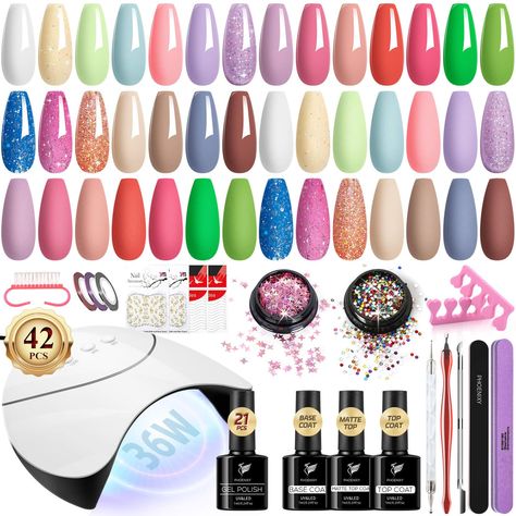 PRICES MAY VARY. Gel nail polish kit - The nail kit includes 21*7ml gel polish, 1*10ml top coat, 1*7ml base coat, 1*7ml matte top coat, 36W U V/LED nail lamp, 1*nail file, 1*nail buffer, 1*nail brush, 1*cuticle trimmer, 1*cuticle pusher, 1*nail dotting pen, 2*nail separators, 3*colored silk yarn, 2*nail french tip, 2*nail metal stickers, 1*nail glitter sequins, 1*nail art rhinestones. 21 Colors All Season Gel Nail Polish - This manicure kit has 21 colors but 42 effects to match every season, eve Basic Nail, Matte Gel, Nail Polish Kit, Gel Nail Kit, Basic Nails, Nail Polish Set, Nail Polish Kits, Gel Top Coat, Gel Nail Polish Set