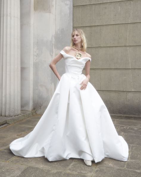 The 2025 Made-to-Order Bridal collection is built upon the house foundations and features eight new gowns and a series of separates and accessories. Each gown is designed to be transformed. The collection is presented as an ode to love: an honour to the everlasting vow. Queen Victoria provided the original inspiration for the 2025 collections, as the first bride to choose white for her wedding gown, breaking with tradition and showing a fierce, independent spirit. Vivienne Westwood Bagatelle, Vivienne Westwood Nova Bagatelle, Nova Bagatelle, Vivienne Westwood Bridal, Vivienne Westwood Wedding Dress, Vivienne Westwood Wedding, Victoria Fashion, The Vivienne, Wedding Professional