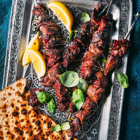 Made with just about any kind of meat, kebabs are classic Iranian street food. Lamb is the predominant red meat eaten in Iran, and its liver is a delicacy. Lemon, garlic and fresh basil nicely balance the liver's mineral flavor. #gameday #football #recipe #eatingwell #healthy Grilled Liver, Liver Recipes, Iranian Food, Dairy Free Eggs, Grilled Onions, Beef Liver, Pakistani Food, Persian Food, Chicken Livers