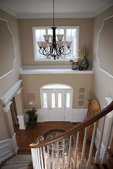 Really getting some good ideas on this. Hmmmm.. Course, I wish my front entry was as large as this. Entryway Wall Color, Foyer Paint Colors, Foyer Paint, Wall Color Ideas, Ledge Decor, Foyer Chandelier, Foyer Decor, Foyer Decorating, Entryway Wall