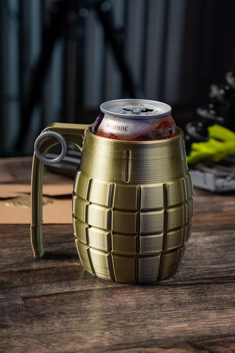 A fun 3D Printing Project meant to mimic the design of a Hand Grenade.  Holds a standard 66mm 12oz Soda Pop Can or Beer.  Also features a faux Pin to complete the look.  Designed using Fusion 360 this 3D Print Project idea is a fun way to enjoy a frosty beverage.  This design also has a mild can koozie insulating effect so it makes it a practical 3D Printer Project idea! FREE DOWNLOAD now available on Thangs.com from MandicReally. 3d Printing Pattern, Cool 3d Printing Ideas To Sell, 3d Printing Projects Free Printable, 3d Print Files Free Printable, 3d Printer Projects To Sell, 3d Printing Ideas Useful Free, Simple 3d Printing Ideas, Beginner 3d Printer Projects, 3d Printed Projects