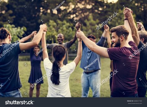 Group of people holding hand together in the park Outdoor Corporate Event, Outdoor Team Building Games, Corporate Event Activities, Team Building Challenges, Team Bonding Activities, Hand Together, Teamwork Activities, Corporate Team Building Activities, Mind Movie