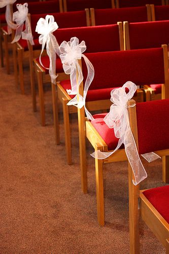 tulle bows on pews in Church.  Easy(??) and cheap DIY Wedding Chair Decorations Diy, Wedding Pew Decorations, Pew Bows Wedding, Pew Decorations, Wedding Pews, Wedding Isles, Pew Bows, Simple Wedding Decorations, Church Wedding Decorations