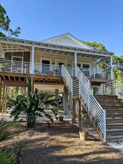 1695 Pompano Ave, Englewood, FL 34223 | Zillow Beach House Exterior On Stilts, House On Stilts Over Water, Farmhouse On Stilts, Small Beach House On Stilts, Stilt House Plans Coastal Homes, Stilt Home, Caddo Lake, Stilt House, Stilt Houses