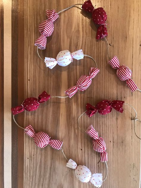 A sweet addition to your holiday decor! This garland consists of wrapped 'candies' in red and white fabrics- both striped and polka dotted. Use to decorate your mantle, Christmas tree, and more! Size- individual 'candies' are about 4 inches long.  *6 foot garland consists of 10 candies  *9 foot garland consists of 16 candies -Each garland is hand crafted with love; meaning that each one is completely unique and may vary slightly. Candy Garland, Love Meaning, Mantle Christmas, Fabric Christmas Decorations, Christmas Craft Fair, Christmas Tree Garland, Christmas Inspo, Diy Garland, Christmas Sewing