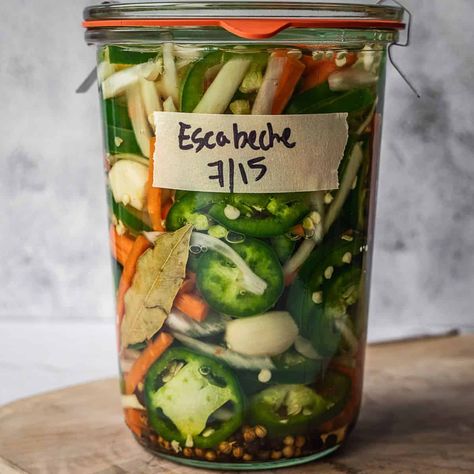 Escabeche (Spicy Mexican Pickled Vegetables) is a classic condiment served at most Mexican restaurants that can easily be made right at home. Mexican Escabeche Recipe, Mexican Pickled Vegetables, Fermented Cucumbers, Escabeche Recipe, Fermenting Recipes, Refrigerator Pickle Recipes, Pickled Green Tomatoes, Pickled Vegetables Recipe, Pickled Turnips