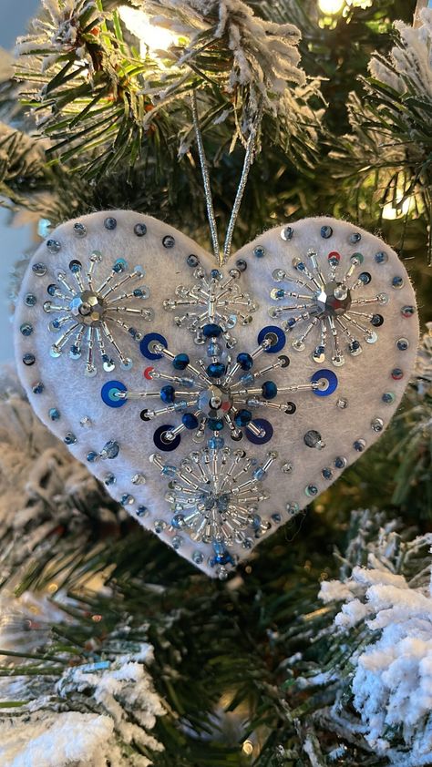 Introducing our exquisite handcrafted heart ornament, a little piece of art that's made with love, care, and attention to detail. Every stitch is carefully placed, every glass bead and sequin is meticulously chosen, resulting in a truly unique and delicate piece that will make the perfect gift for someone special. Crafted from quality felt and adorned with beautiful glass beads and sequins, this heart ornament will be treasured for years to come. Whether you want to give it as a gift or keep it Beaded Tree Ornament, Frozen Tree, Christmas Felt Ornaments, Blue Christmas Ornaments, Heart Christmas Ornaments, Christmas Blue, Felt Christmas Decorations, Christmas Hearts, Beaded Christmas Ornaments